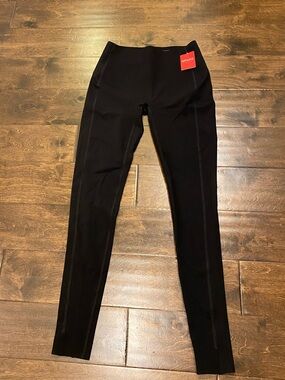 Spank hem slit black leggings size small